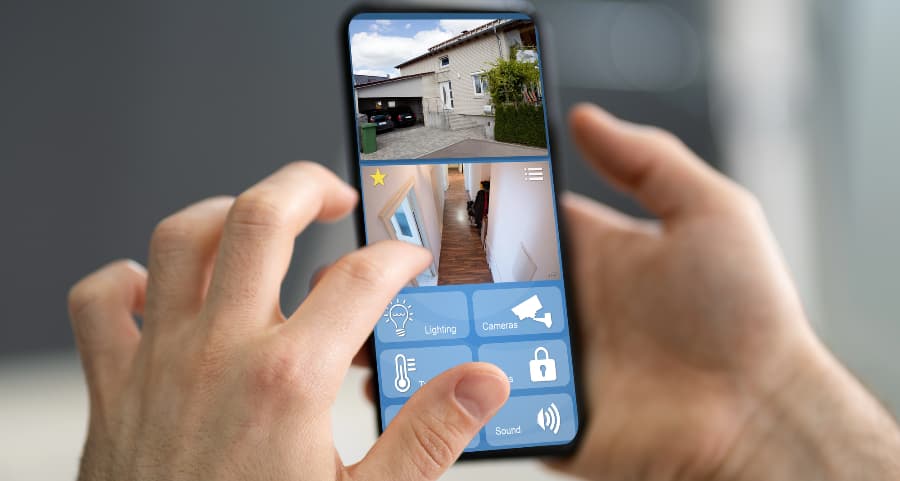 Resident examining video camera feeds on a smartphone